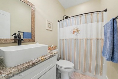 Nestled amongst majestic Live Oaks on one of Waveland's most - photo 21