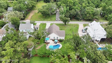 Nestled amongst majestic Live Oaks on one of Waveland's most - photo 33