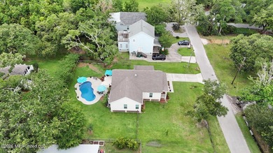 Nestled amongst majestic Live Oaks on one of Waveland's most - photo 35