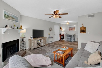 Beautifully updated second-floor condominium located on the - photo 2