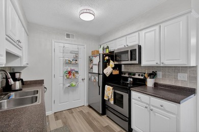 Beautifully updated second-floor condominium located on the - photo 4