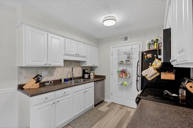 Beautifully updated second-floor condominium located on the - photo 5