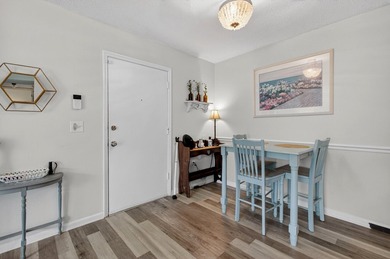 Beautifully updated second-floor condominium located on the - photo 6