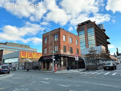 Park-front commercial building on a corner lot directly across - photo 1