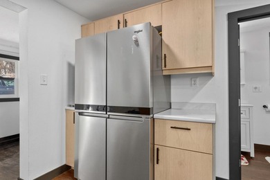 This updated contemporary city home features a convenient floor - photo 3