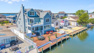 Stunning custom-designed 4BR, 3BA waterfront home on a wide - photo 1