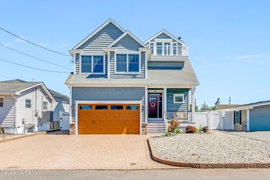 Stunning custom-designed 4BR, 3BA waterfront home on a wide - photo 5
