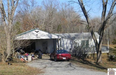 This home is a fixer upper/investment property, situated on 4 - Lake Home For Sale in Cadiz, Kentucky