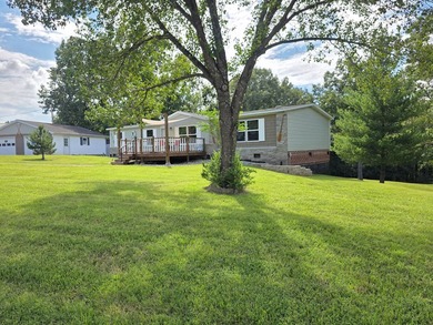 Charming lake retreat featuring a seasonal water view and - photo 3