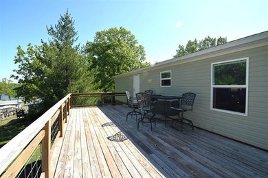 Charming lake retreat featuring a seasonal water view and - photo 10
