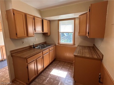 Welcome to this charming bungalow in the heart of Euclid. This - photo 7