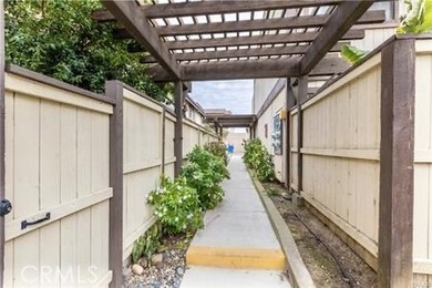 This 2-story condo offers comfortable living in the gated Coral - photo 2