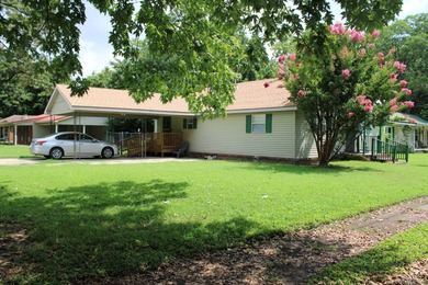 This property sits on a cover lot. The house has vinyl siding, 1