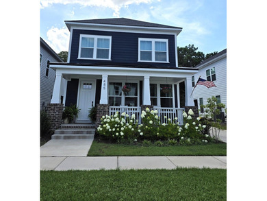 Welcome to this stunning Craftsman-inspired home in the highly - photo 1