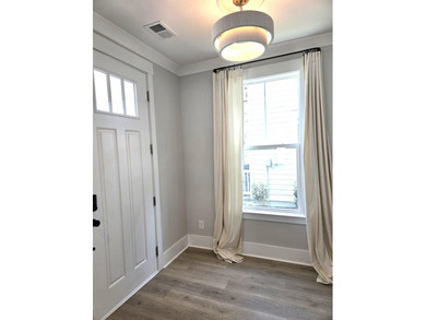 Welcome to this stunning Craftsman-inspired home in the highly - photo 2