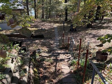 WATERFRONT RETREAT WITH SHOP & DOCK! Nestled on three beautiful - photo 3