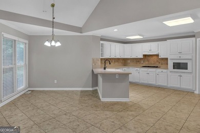 Welcome home to this beautifully maintained 3-sided brick ranch - photo 11