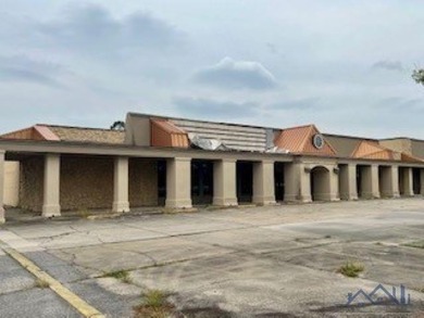 This retail listing is for the former Furniture Place building