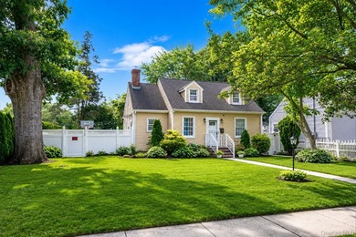 Welcome to this charming 4-bedroom, 2-bath Cape Cod situated on - photo 1
