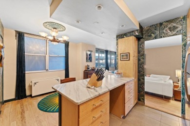 This fully renovated 1,100 sq ft Riviera Towers 1-bedroom