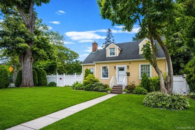 Welcome to this charming 4-bedroom, 2-bath Cape Cod situated on - photo 3