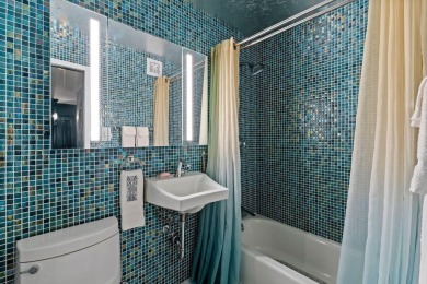 This fully renovated 1,100 sq ft Riviera Towers 1-bedroom