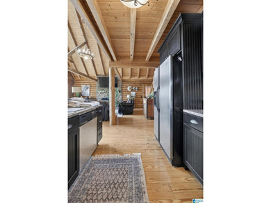 Experience refined lakefront living in this exceptional log - photo 36