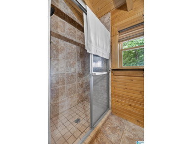 Experience refined lakefront living in this exceptional log - photo 40