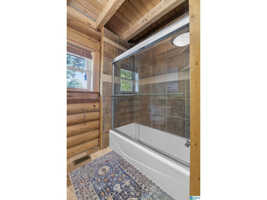 Experience refined lakefront living in this exceptional log - photo 41
