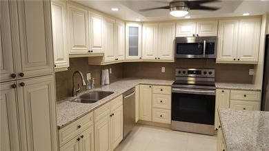 Updated condo with great NE ocean views. Wood tile floors. Split - photo 4