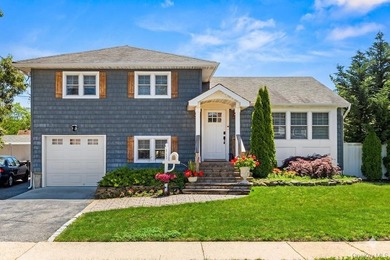 This charming West Islip Multi-level home perfectly blends - photo 1