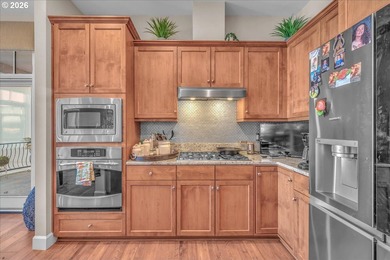 Experience elevated riverfront living in this top-floor