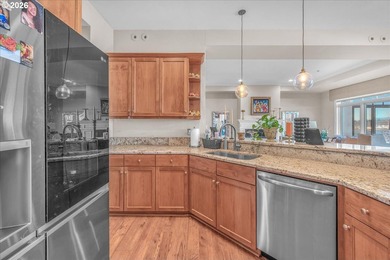 Experience elevated riverfront living in this top-floor