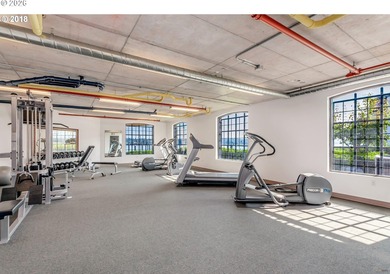 Experience elevated riverfront living in this top-floor