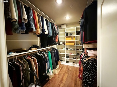 Experience elevated riverfront living in this top-floor