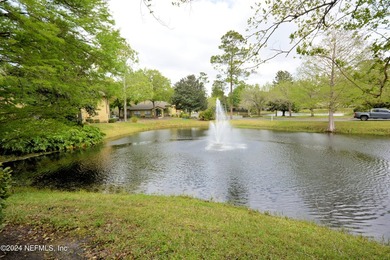 Discover this rare ground-floor unit nestled in a sought after - photo 2