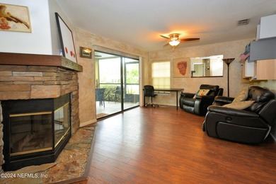 Discover this rare ground-floor unit nestled in a sought after - photo 3