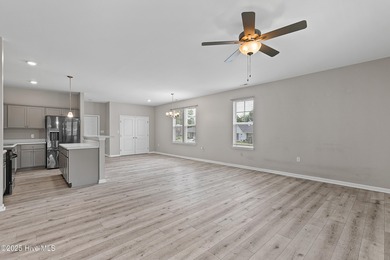 This 5-bedroom home offers an open-concept living area and