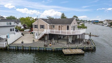 Waterfront living at its finest! This elevated and updated 2Br - photo 1