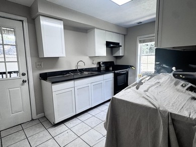 Welcome home to this spacious 4-bedroom, 2-bath residence - photo 3
