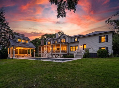 Nestled beneath a canopy of majestic live oaks within the - photo 3