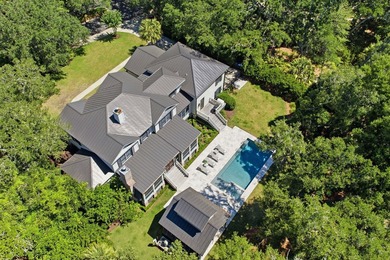 Nestled beneath a canopy of majestic live oaks within the - photo 4