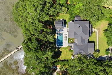 Nestled beneath a canopy of majestic live oaks within the - photo 5