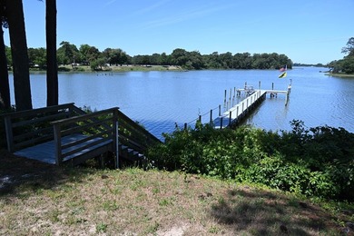 Majestically perched atop a high bluff on 2.31 acres at the head - photo 13