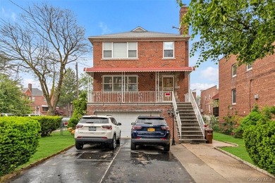 Spacious, brick, detached two-family home on a 50X100 corner lot - photo 1