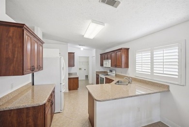 Welcome home to this impeccably kept home in a 55+ gated - photo 14