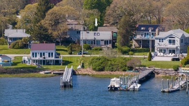 Nestled on desirable Harbour Island, this charming shingle-style - photo 2