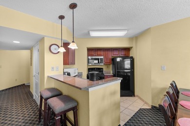 This beautifully furnished three bedroom Penthouse level unit at - photo 5