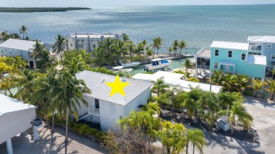 Stunning! Custom designed and built, elevated CBS home on a - photo 1