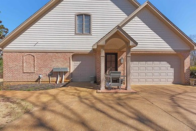 This elegant executive brick home offers luxury living and